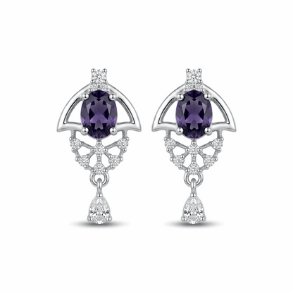Pair of silver earrings with purple gemstones on a white background