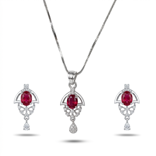 Jewelry set with pendant and earrings featuring red gemstones on a white background