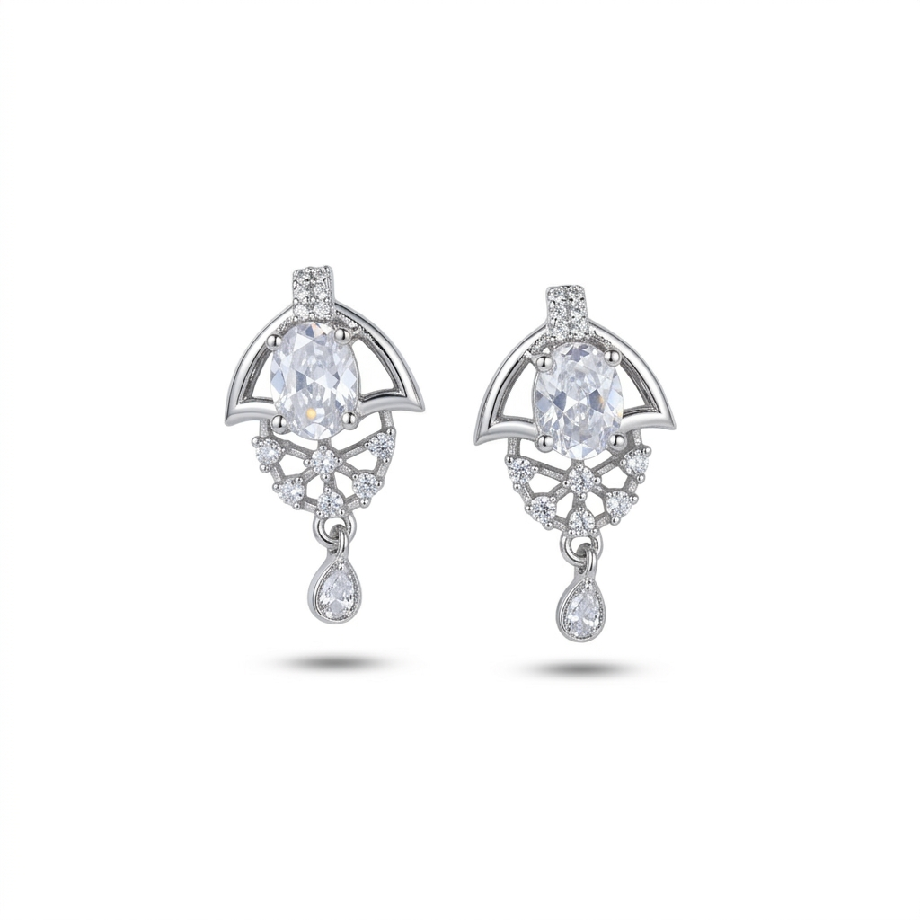 Pair of silver earrings with clear gemstones on a white background