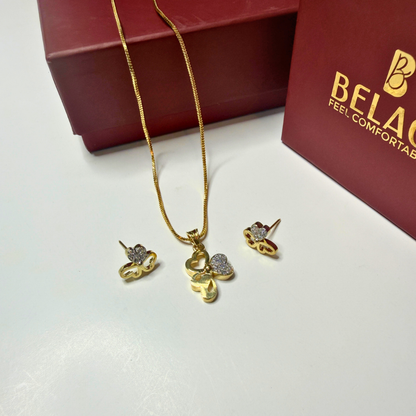 Gold necklace and earrings set with Bel Air box in the background