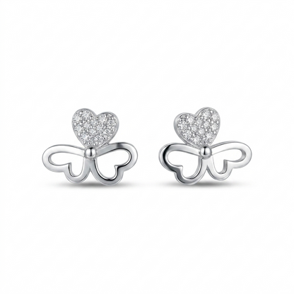 Butterfly-shaped earrings with heart details on a white background