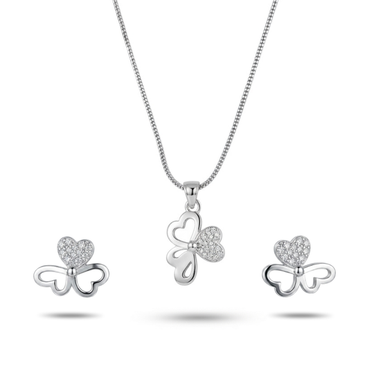 Silver bow-shaped jewelry set with heart details on a white background