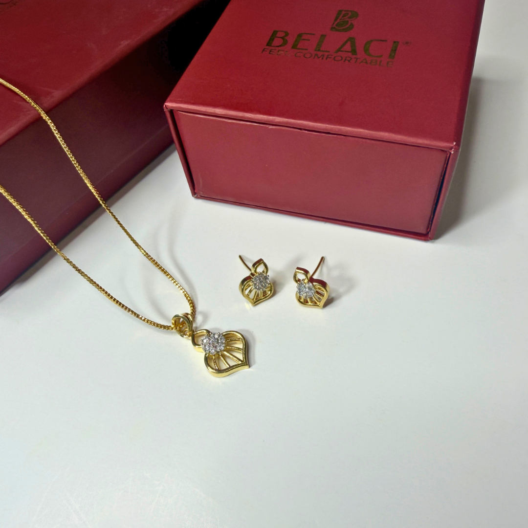 Gold necklace and earrings with a Belaci box on a white background