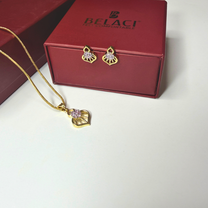 Gold necklace and earrings with pink stones on a Belaci branded box.