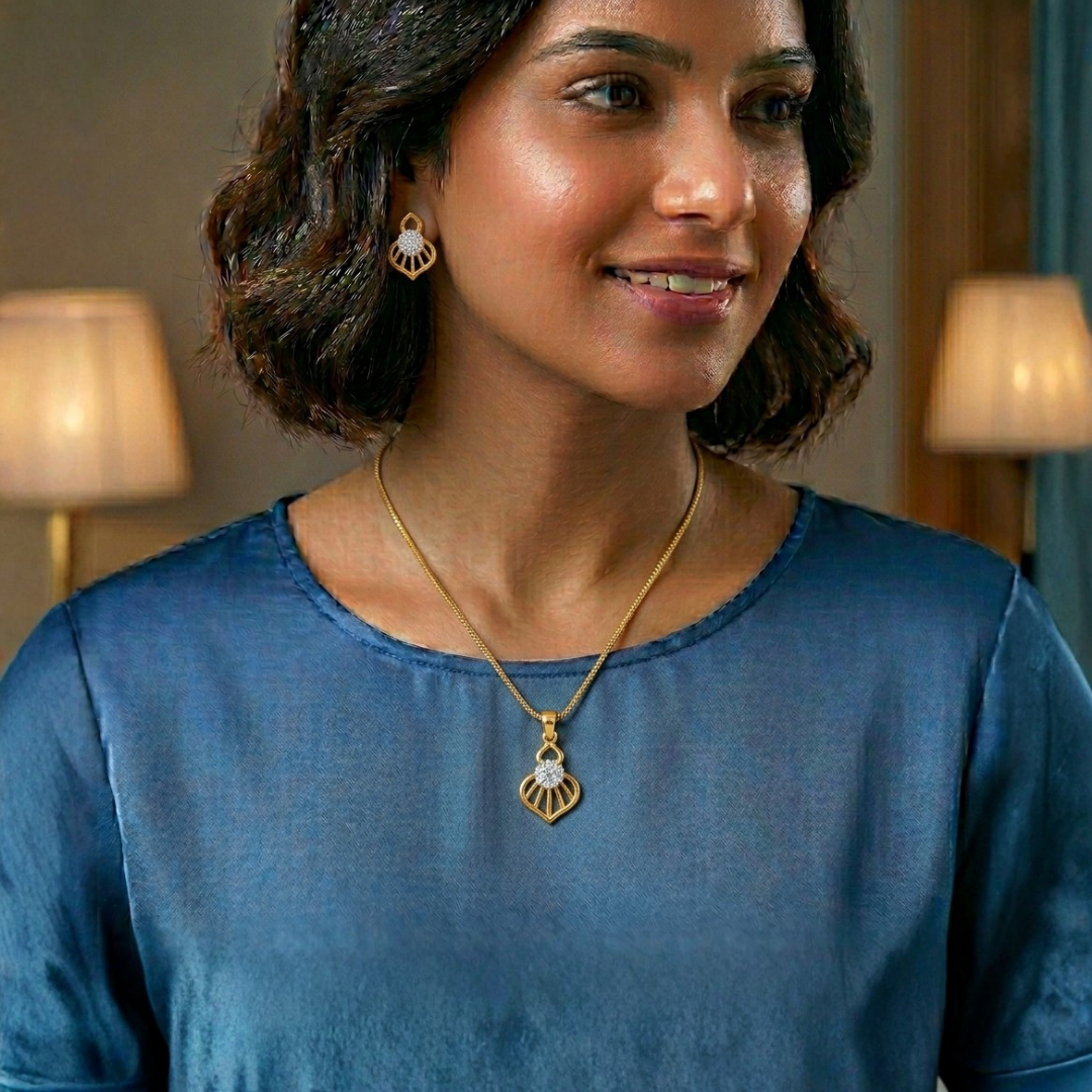 Woman wearing a gold necklace with a pendant indoors