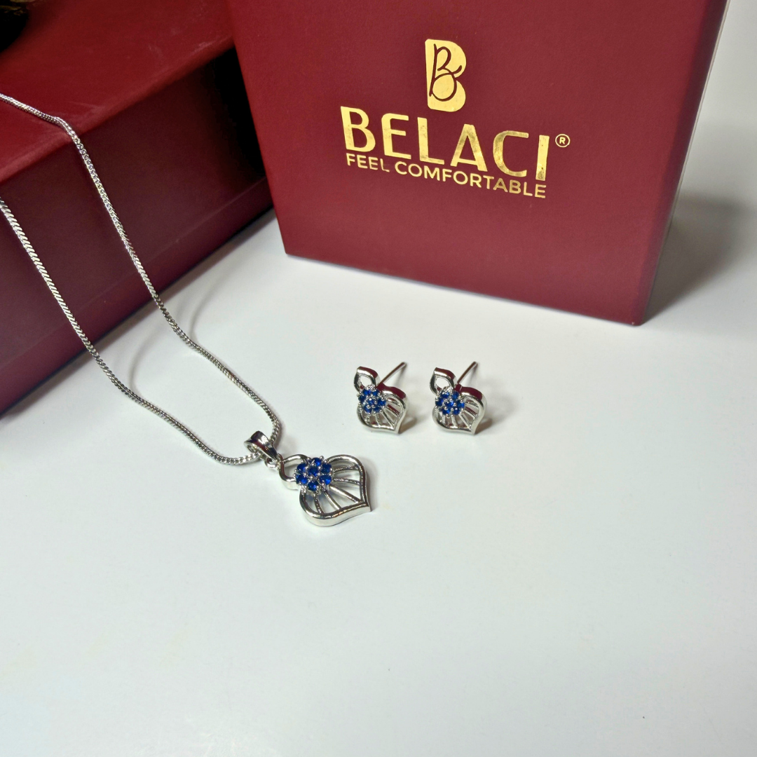 Jewelry set with necklace and earrings in front of a BELACI branded box.
