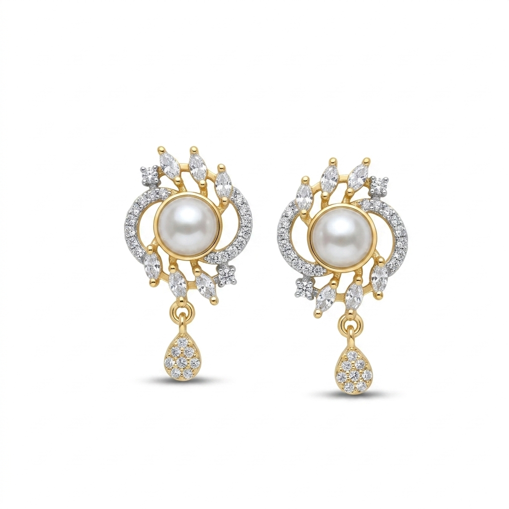 Gold and pearl earrings on a white background