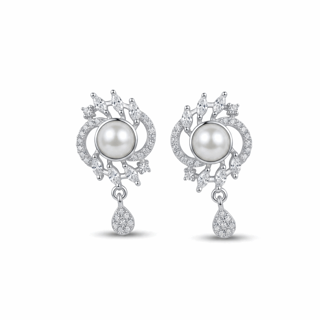 Pair of earrings with pearls and diamond-like stones on a white background