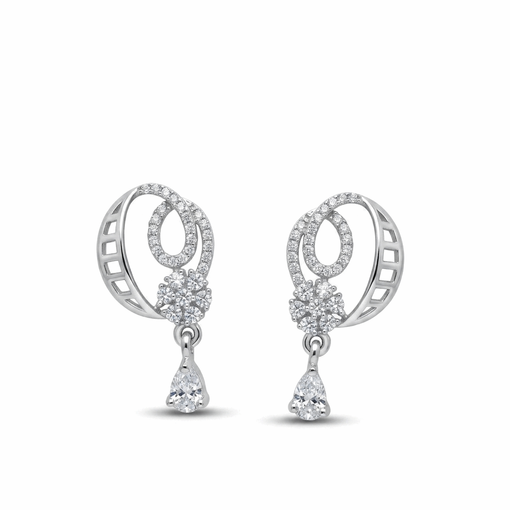 Pair of silver earrings with circular designs and teardrop-shaped elements on a white background