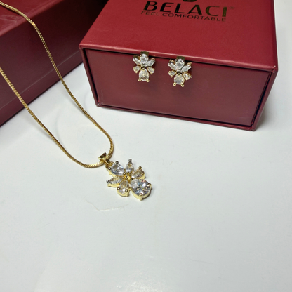 Gold necklace and earrings with a red BELACCI box on a white background