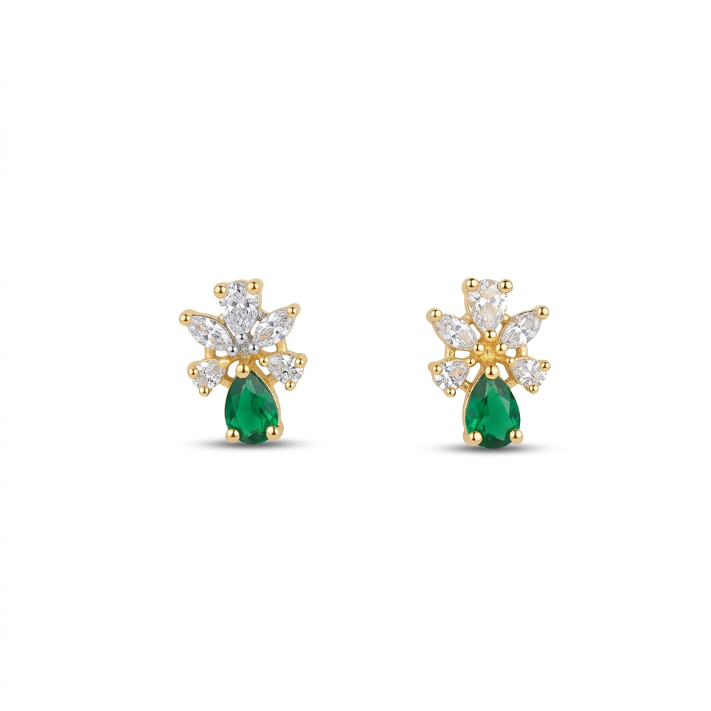 Gold earrings with green gemstones on a white background