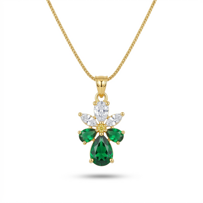 Gold necklace with a green gemstone pendant on a white background