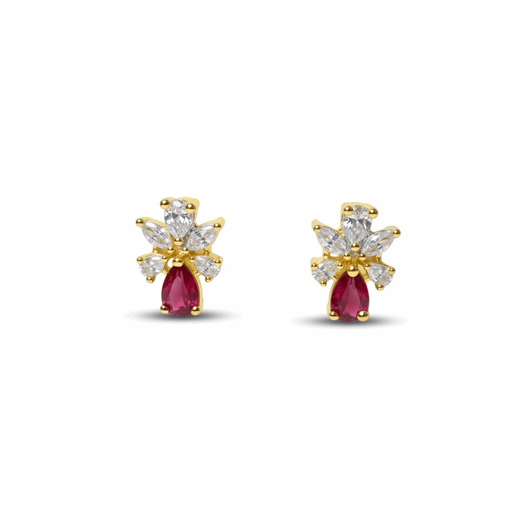 Pair of gold and pearl earrings on a white background