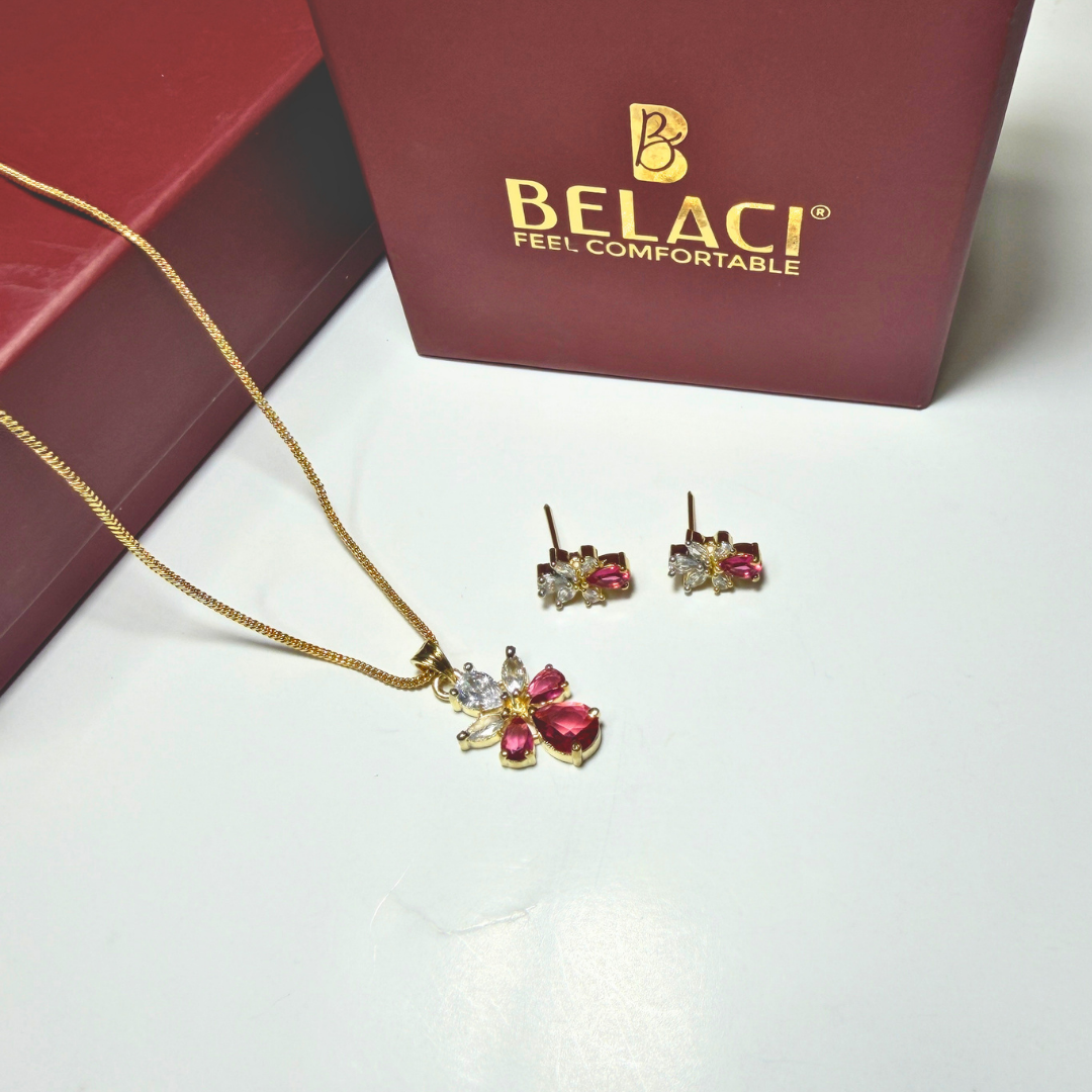 Jewelry set with necklace and earrings in front of a Belaci box.