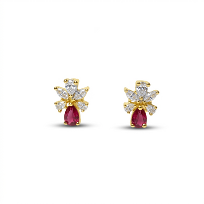 Pair of gold and pearl earrings on a white background