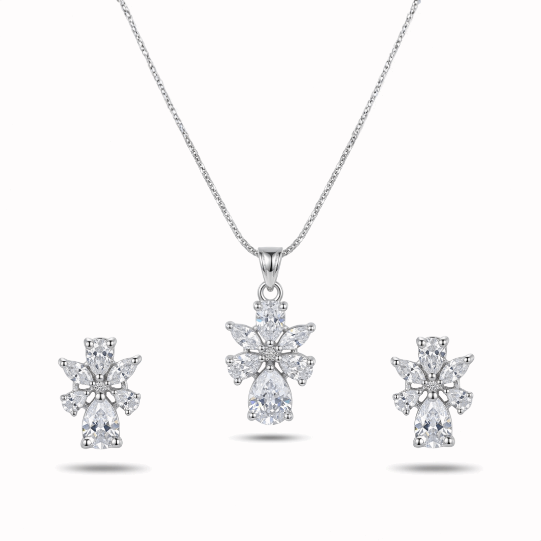 Diamond necklace and earrings set on a white background