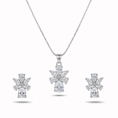 Diamond necklace and earrings set on a white background