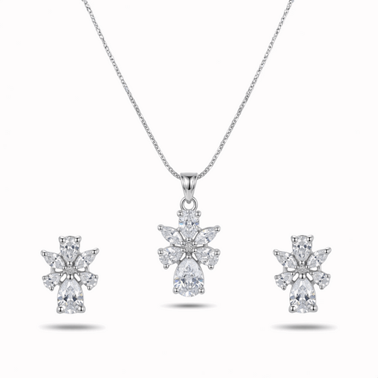 Diamond necklace and earrings set on a white background