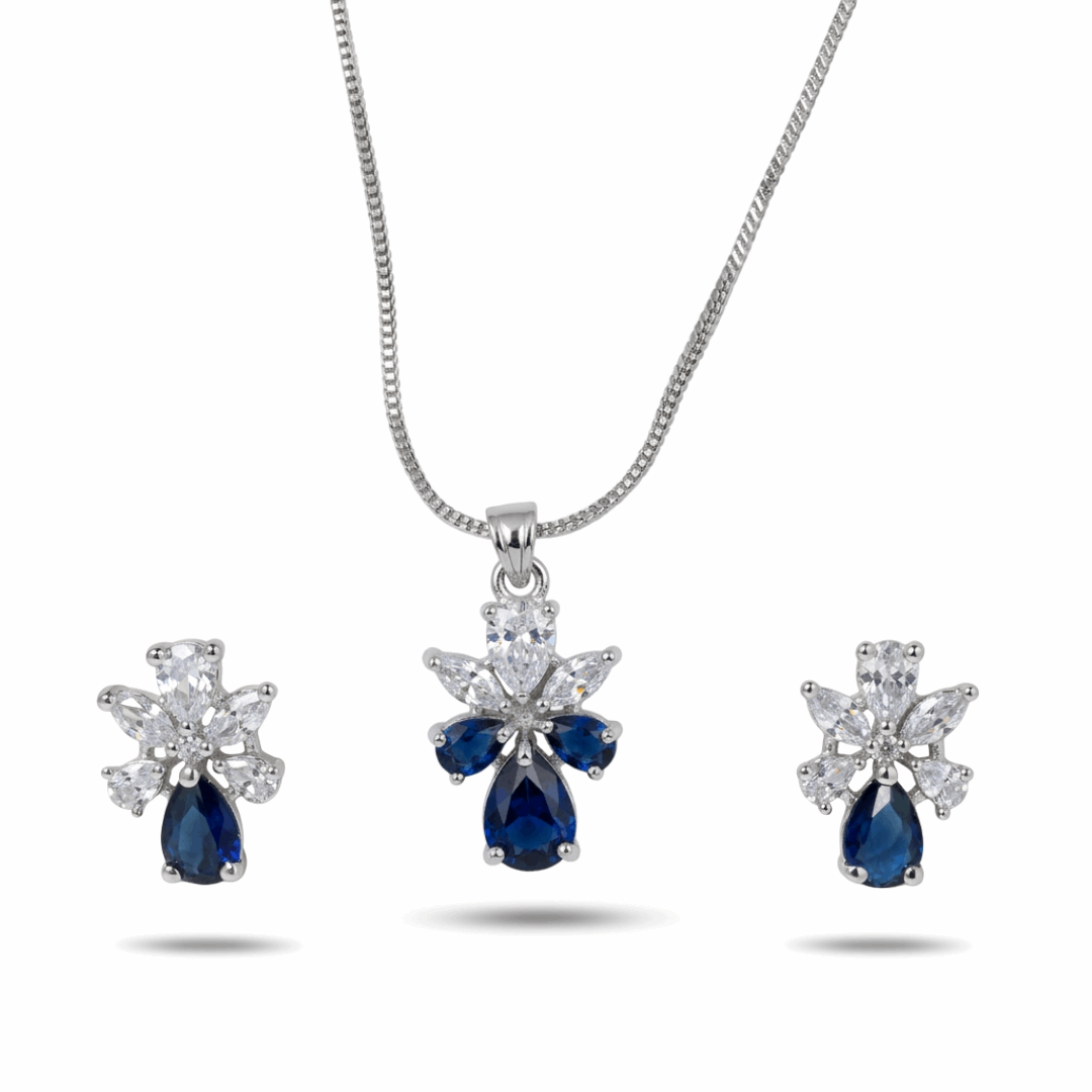 Jewelry set with blue teardrop-shaped gemstones and diamond accents on a white background