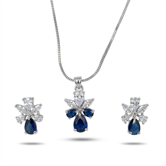 Jewelry set with blue teardrop-shaped gemstones and diamond accents on a white background
