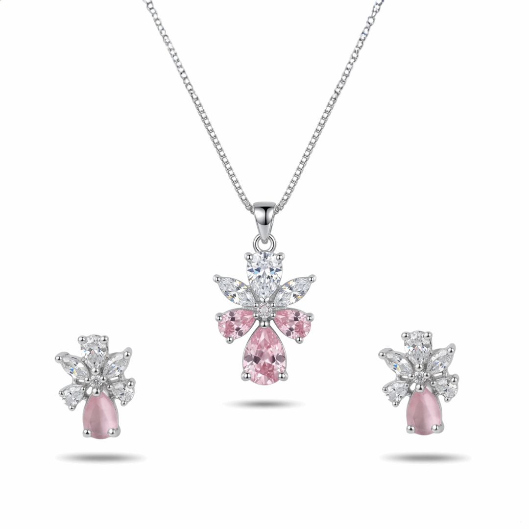 Jewelry set with pink gemstone pendant and earrings on a white background