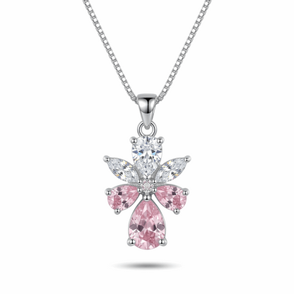 Silver necklace with a pink flower-shaped pendant on a white background