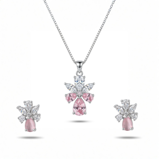 Jewelry set with pink gemstone pendant and earrings on a white background