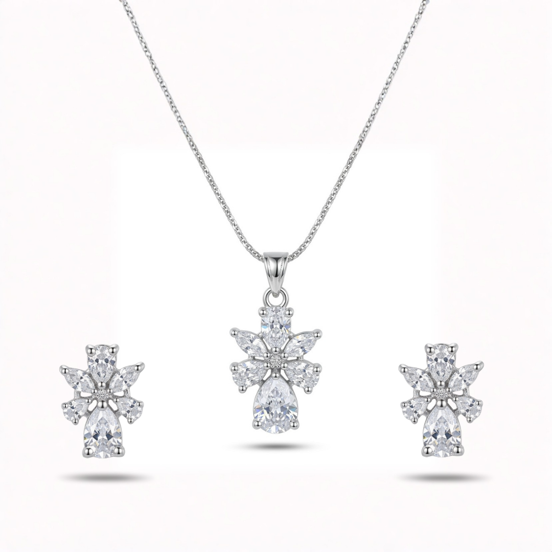 Diamond necklace and earrings set on a white background