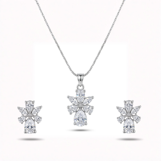 Diamond necklace and earrings set on a white background