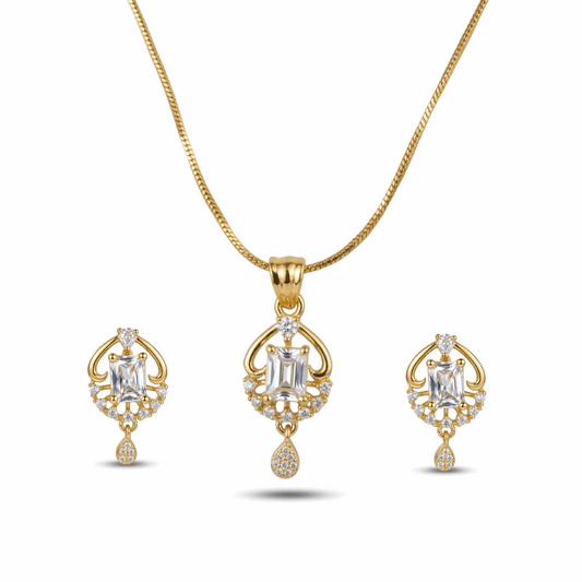 Gold necklace and earrings set on a white background