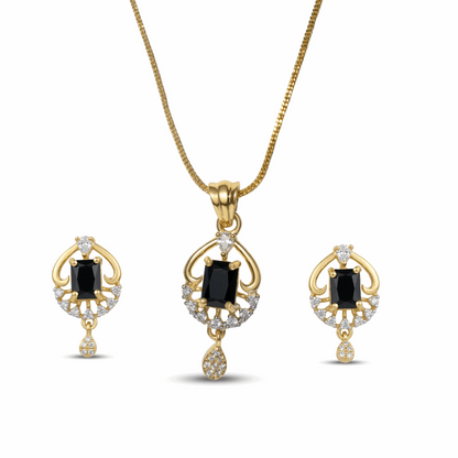 Gold jewelry set with black gemstones on a white background