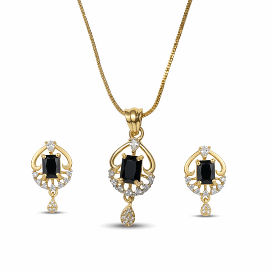 Gold jewelry set with black gemstones on a white background