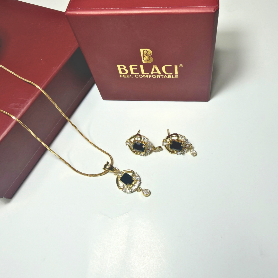 Gold necklace and earrings with a BELACI box on a white background
