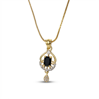 Gold pendant with a black gemstone on a white background