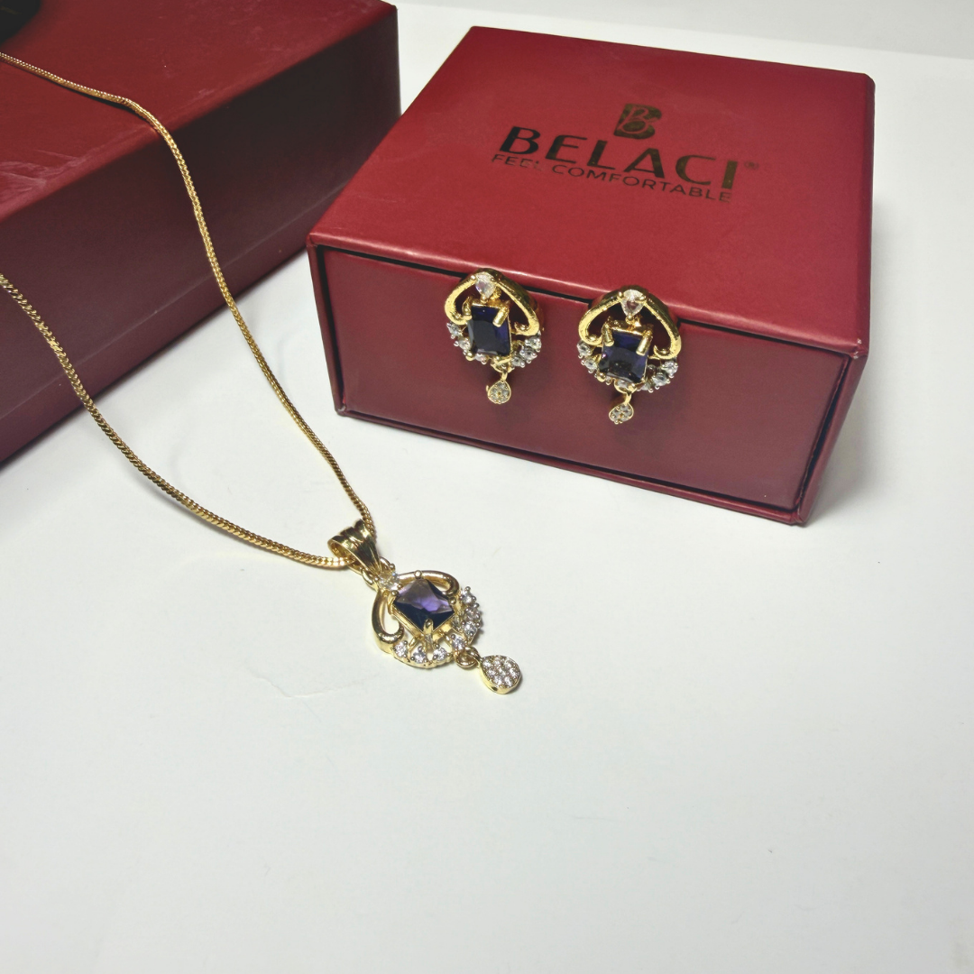 Gold necklace and earrings with a BELACI box in the background
