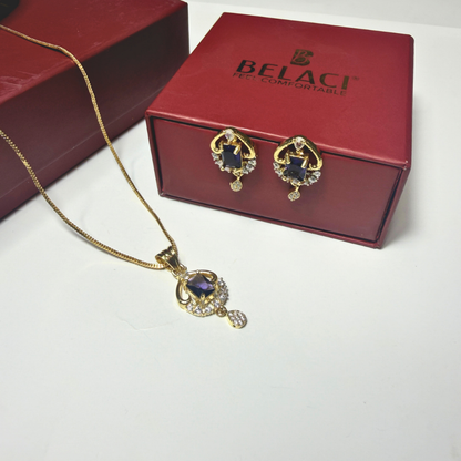 Gold necklace and earrings with a BELACI box in the background