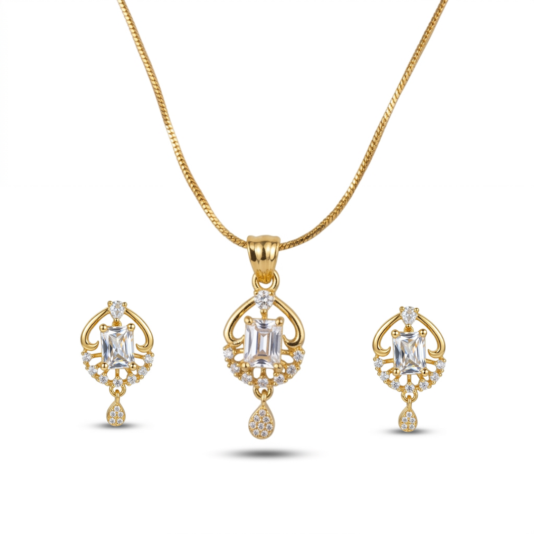 Gold necklace and earrings set on a white background
