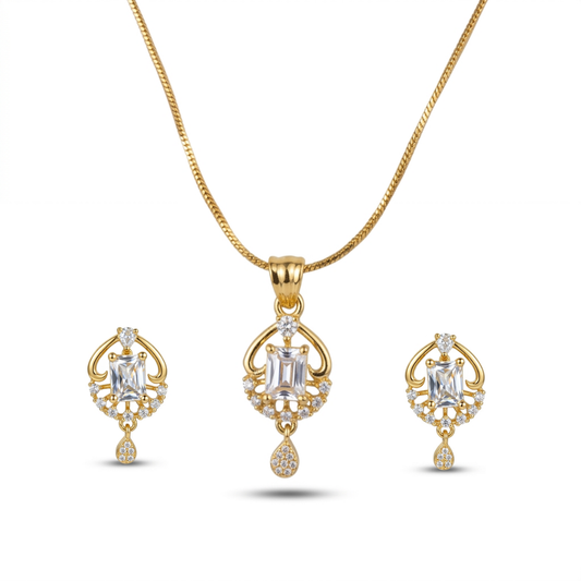 Gold necklace and earrings set on a white background
