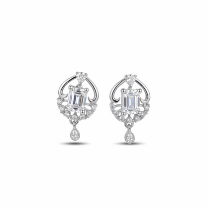 Pair of silver earrings with gemstones on a white background