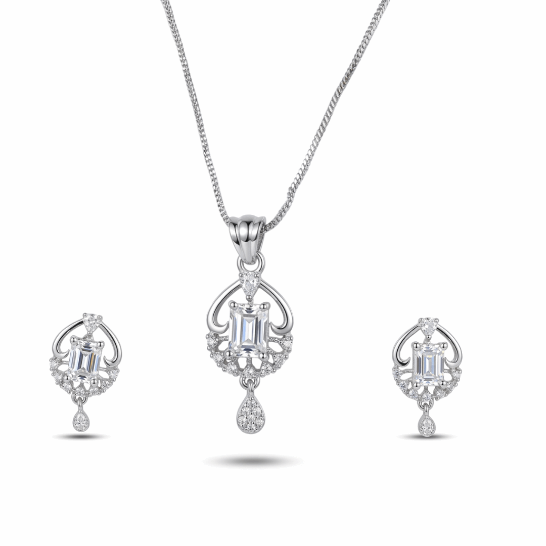 Silver jewelry set with pendant and earrings on a white background
