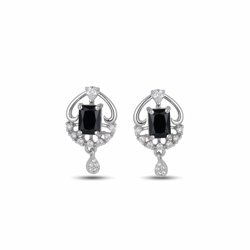 Pair of earrings with black gemstones and diamond accents on a white background