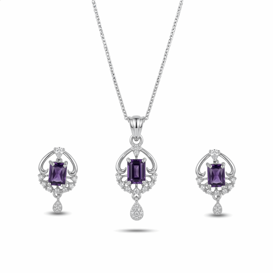 Jewelry set with purple gemstones on a white background