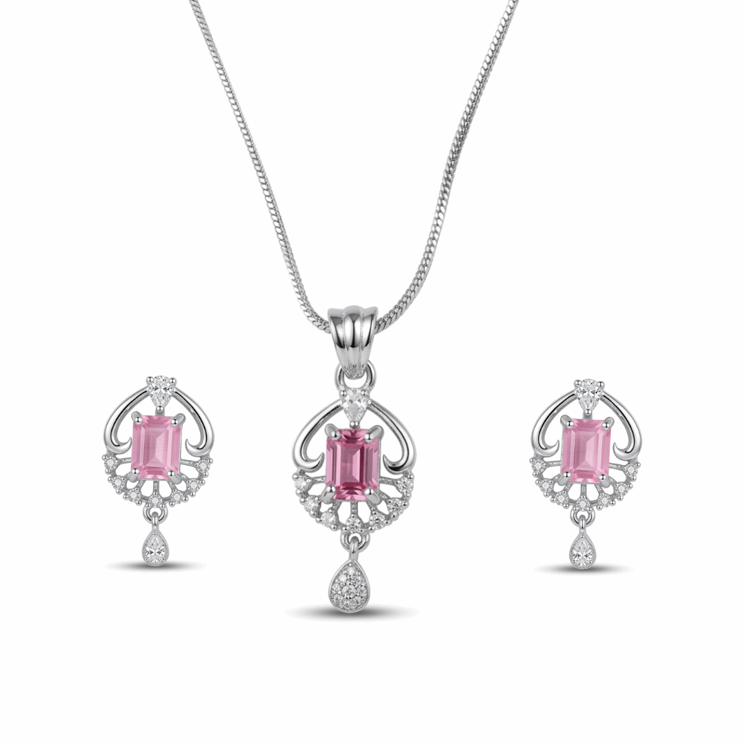 Jewelry set with pink gemstones on a white background