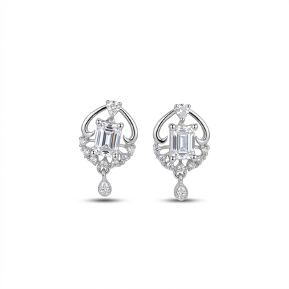 Pair of silver earrings with gemstones on a white background