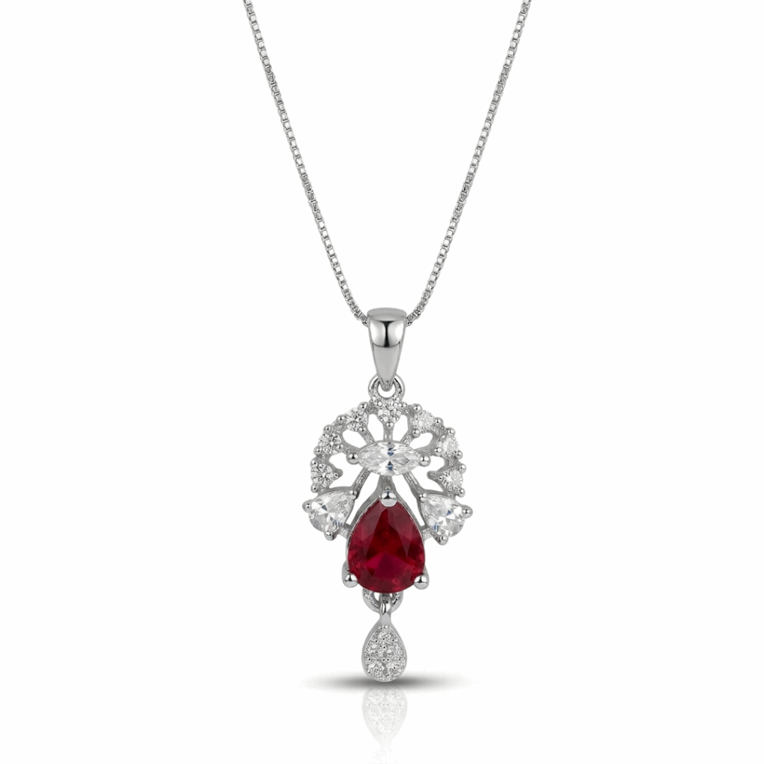 Silver necklace with a red gemstone pendant on a white background
