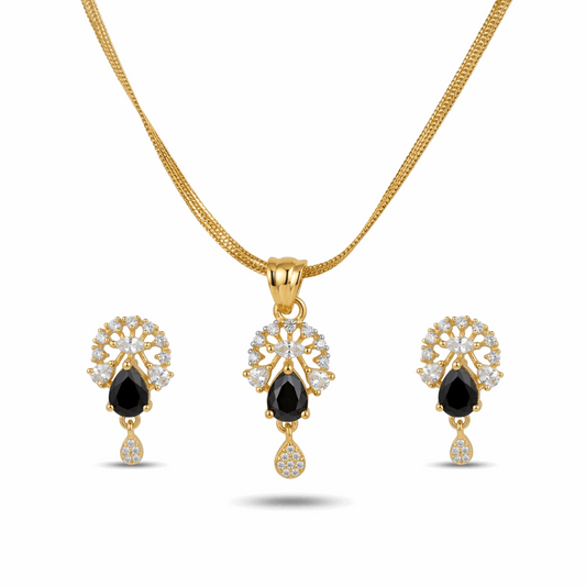 Gold jewelry set with black gemstones on a white background