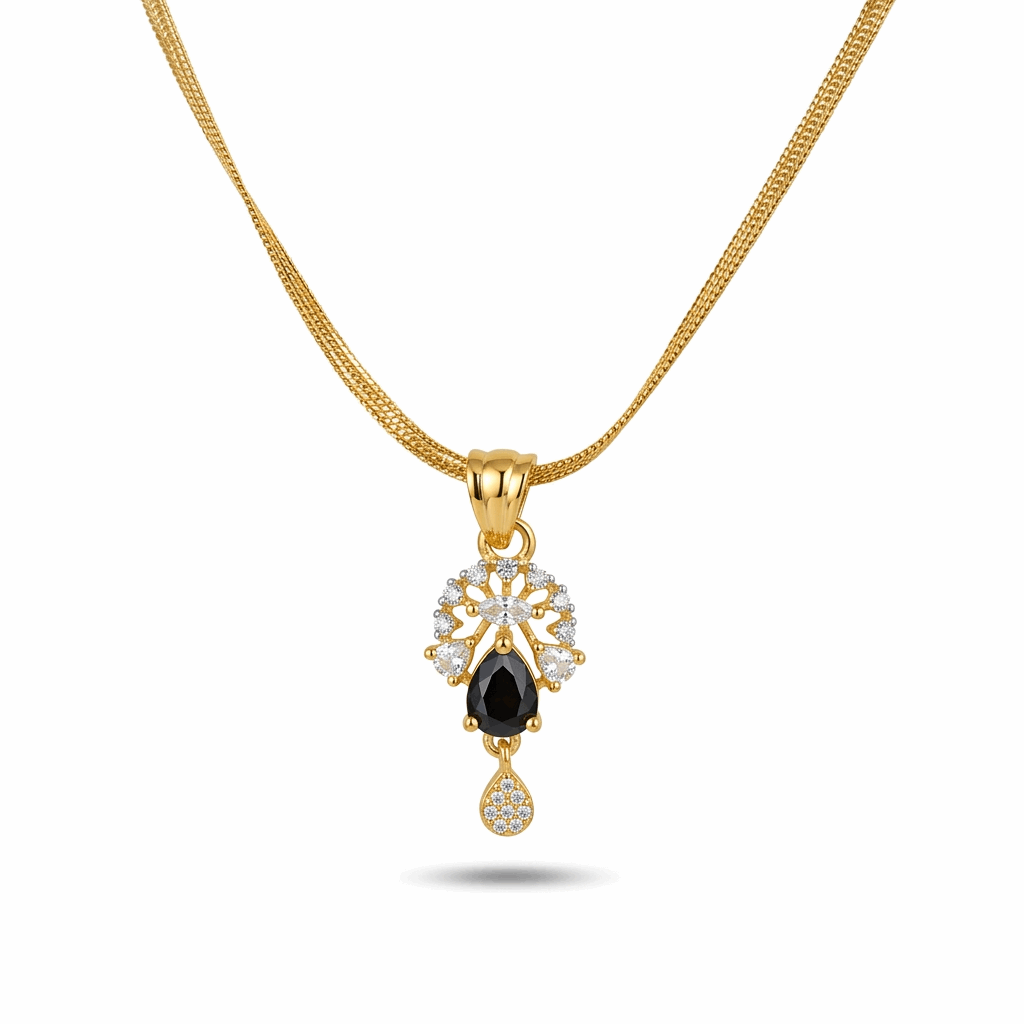 Gold necklace with a black gemstone pendant on a white background