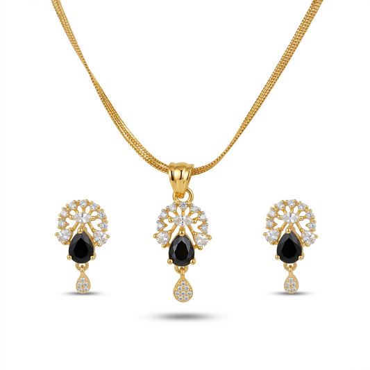 Gold jewelry set with black gemstones on a white background
