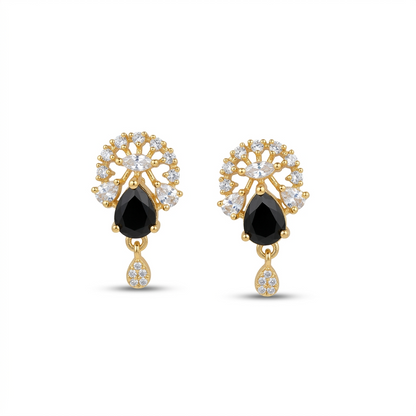 Gold earrings with black teardrop stones on a white background