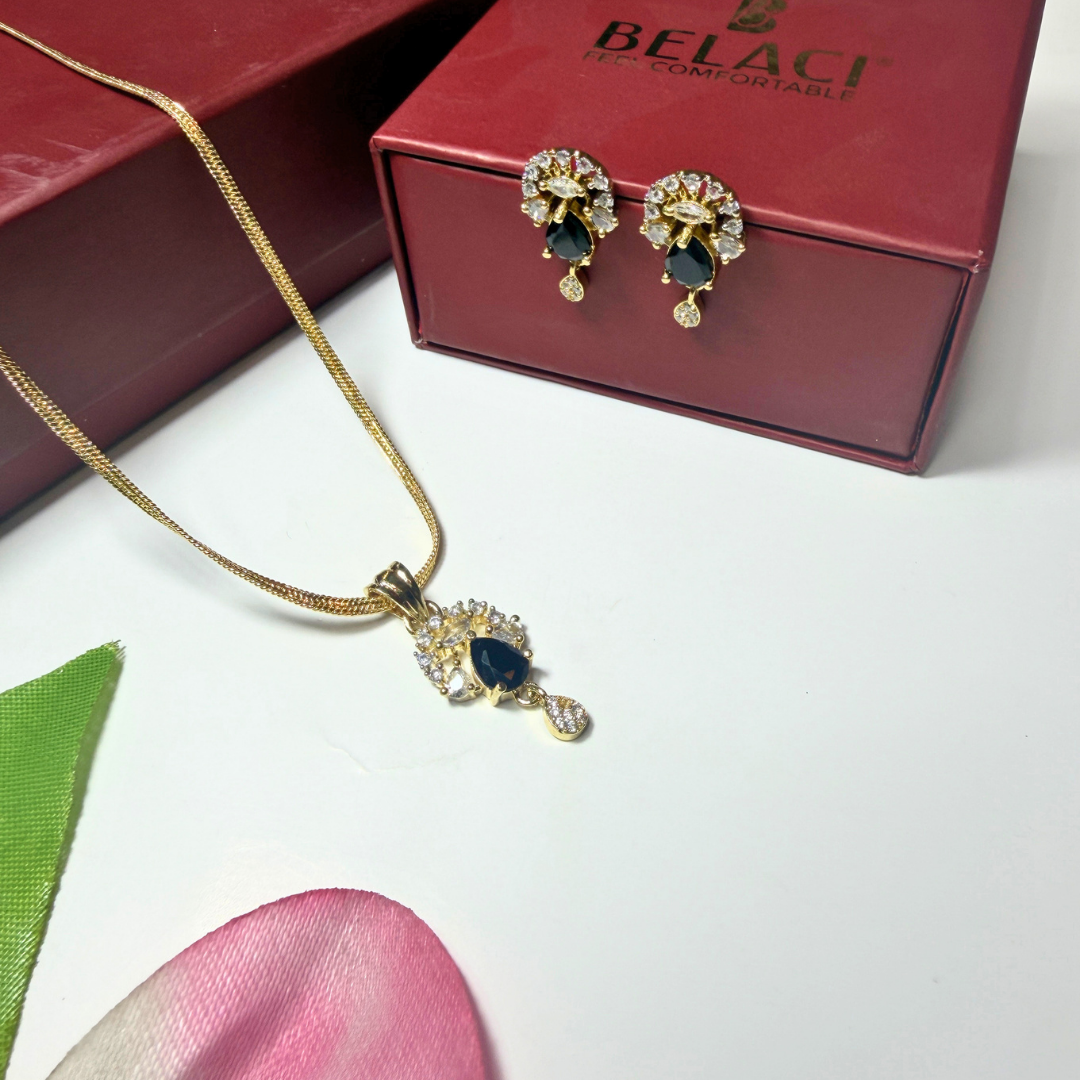 Jewelry set with necklace and earrings on a white surface with a red BELACCI box in the background.